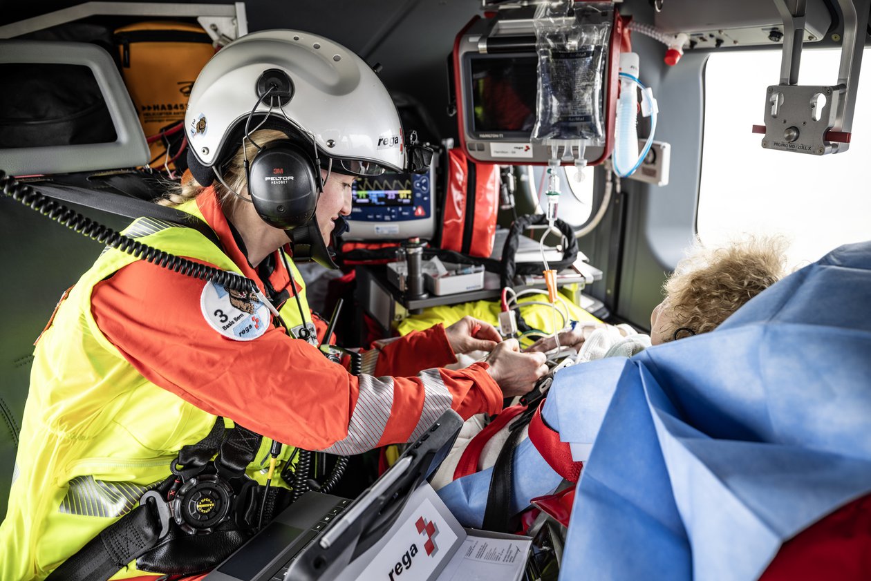 Flight physician helicopter with patient in the Rega helicopter