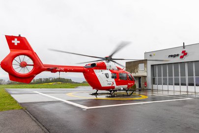 Rescue helicopter in front of the hangar at the base