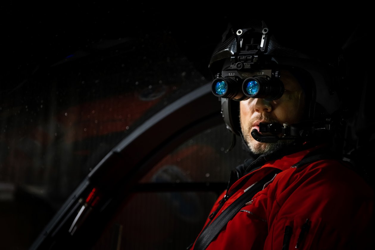 A pilot with night vision goggles.