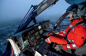  Helicopter pilot in front of his IFR cockpit