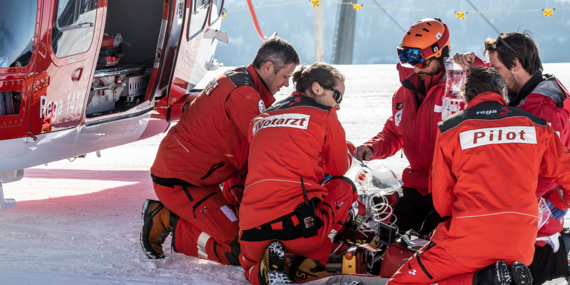 Rega crew attending to an injured person.