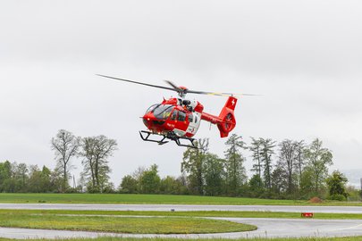 Rescue helicopter against a grey sky