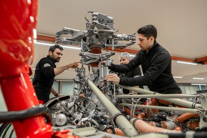 Helicopter mechanics working on an engine